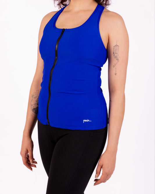 Person wearing a blue tank top with a black zipper on a white background